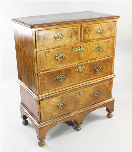 An 18th century walnut and featherbanded chest on stand, W.3ft 4in.